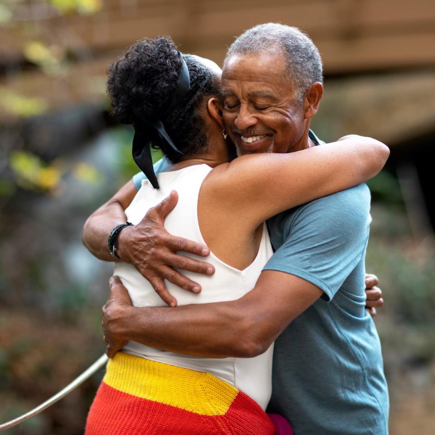 A family member warmly embracing an elder